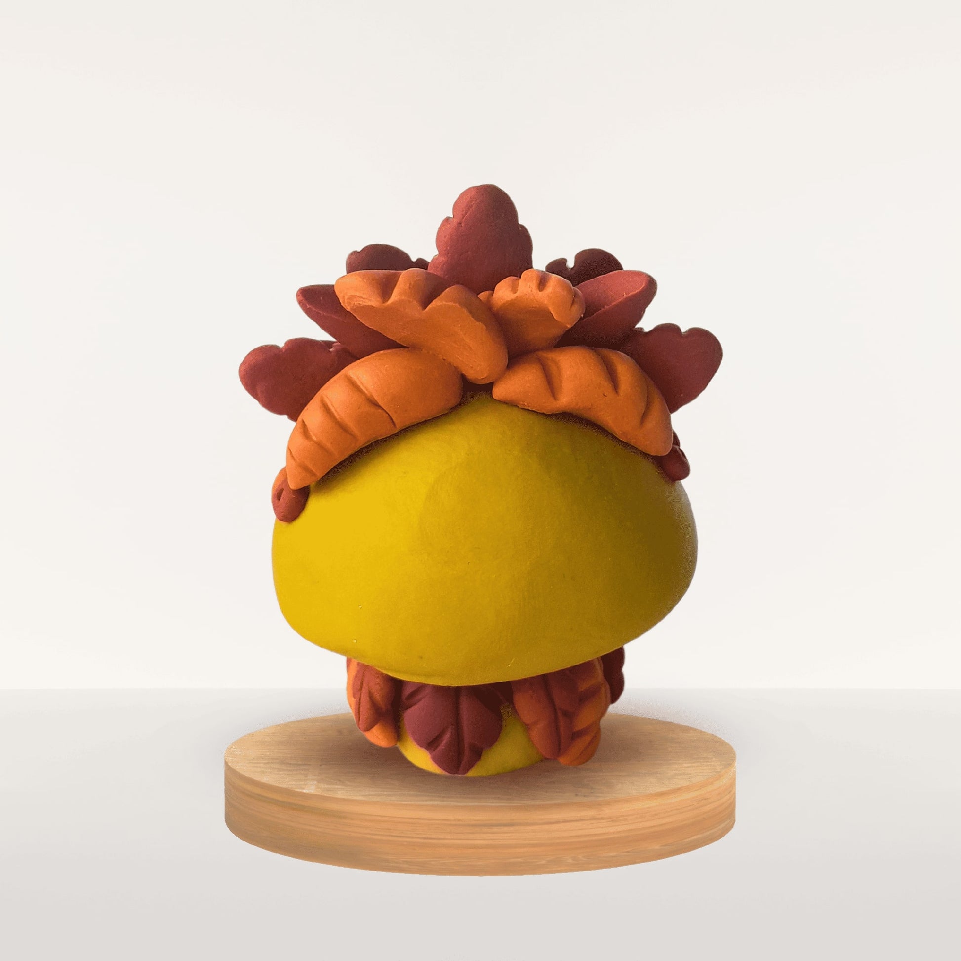 Talisman Plume Curcuma – création artisanale en pâte Fimo